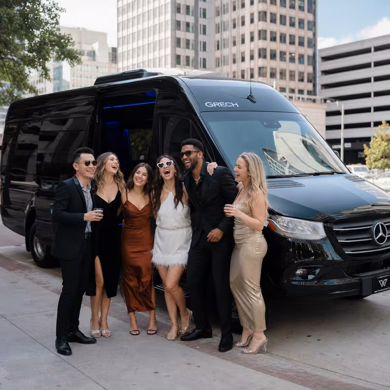 Group boarding a white charter bus for Bachelor & Bachelorette Transportation transportation in Arlington