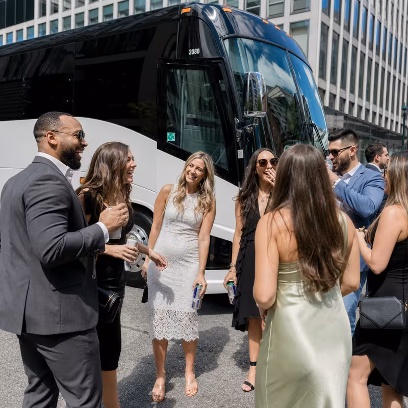 Passengers loading luggage while boarding an Arlington group shuttle
