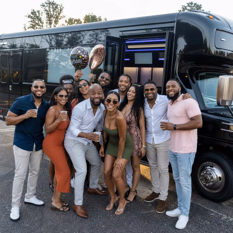 Group boarding a white charter bus for Birthday Transportation transportation in Arlington