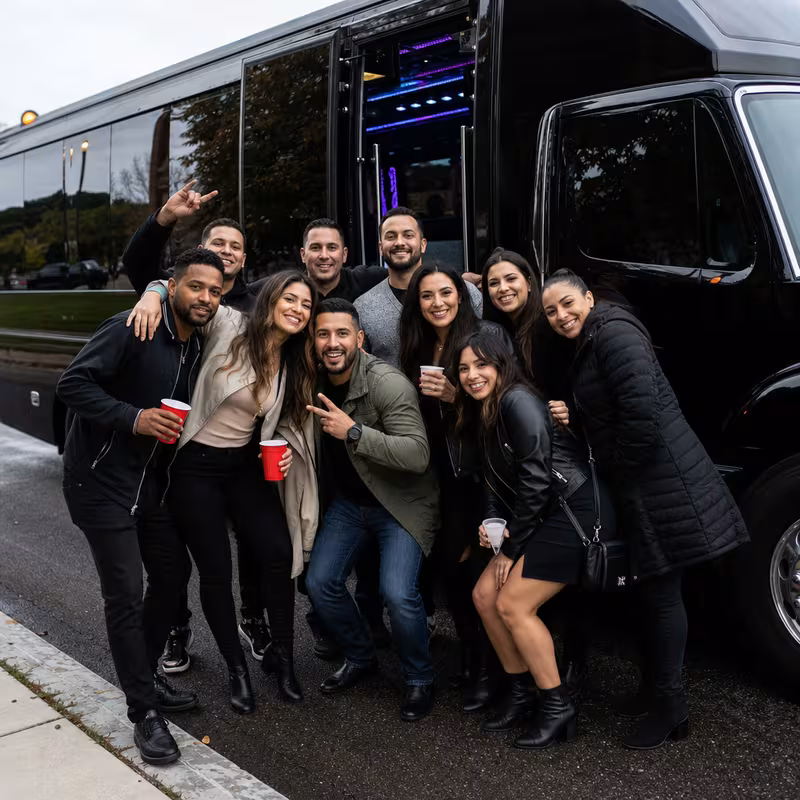 Party bus interior with wraparound leather seating and LED lighting in Arlington