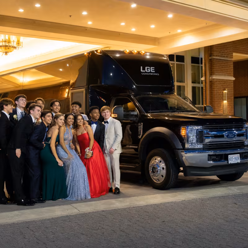 Party bus interior with wraparound leather seating and LED lighting in Arlington