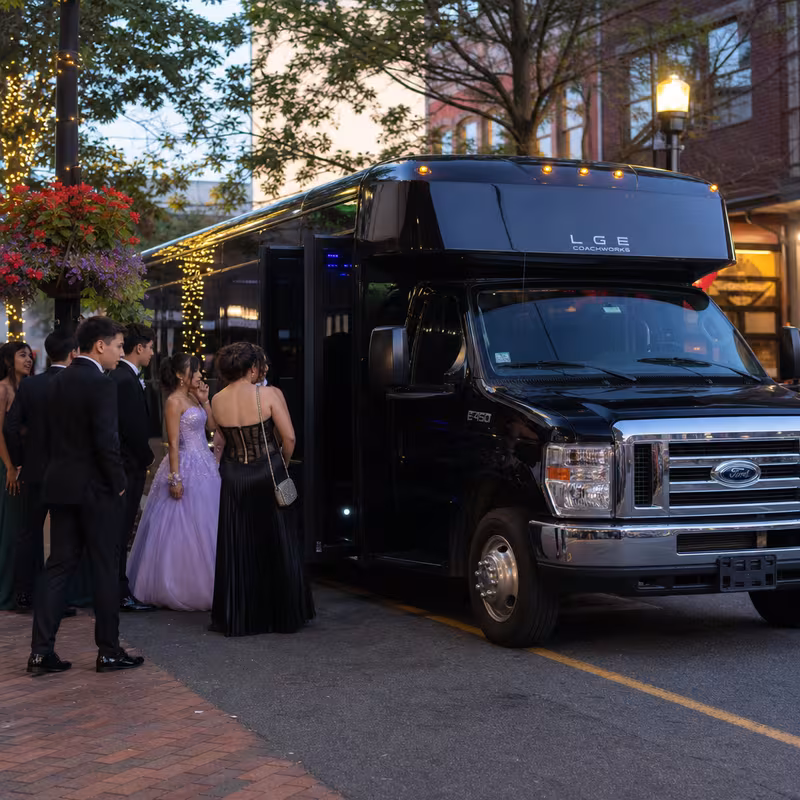 Passengers loading luggage while boarding an Arlington group shuttle
