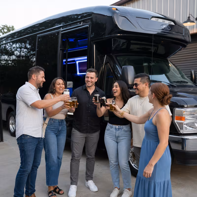 Passengers loading luggage while boarding an Arlington group shuttle